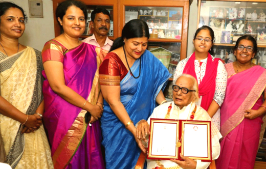 Receiving Karnataka Rajyotsava award